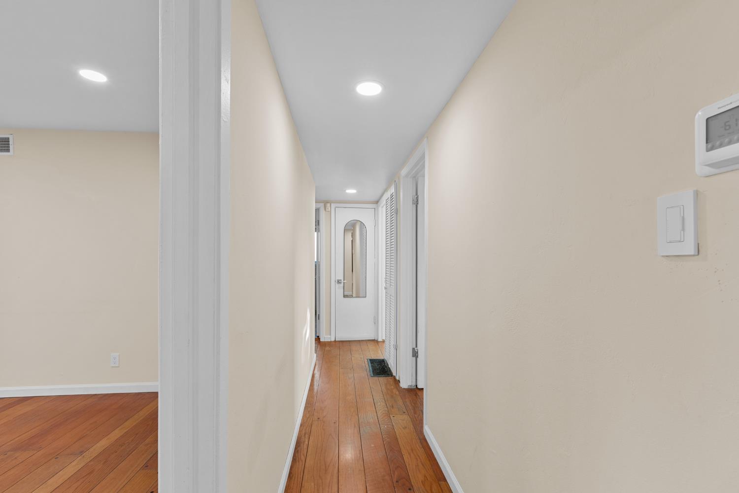 2121 Aaron Way Sacramento, CA 95822 - Photo 13 of 47 a view of a hallway with wooden floor