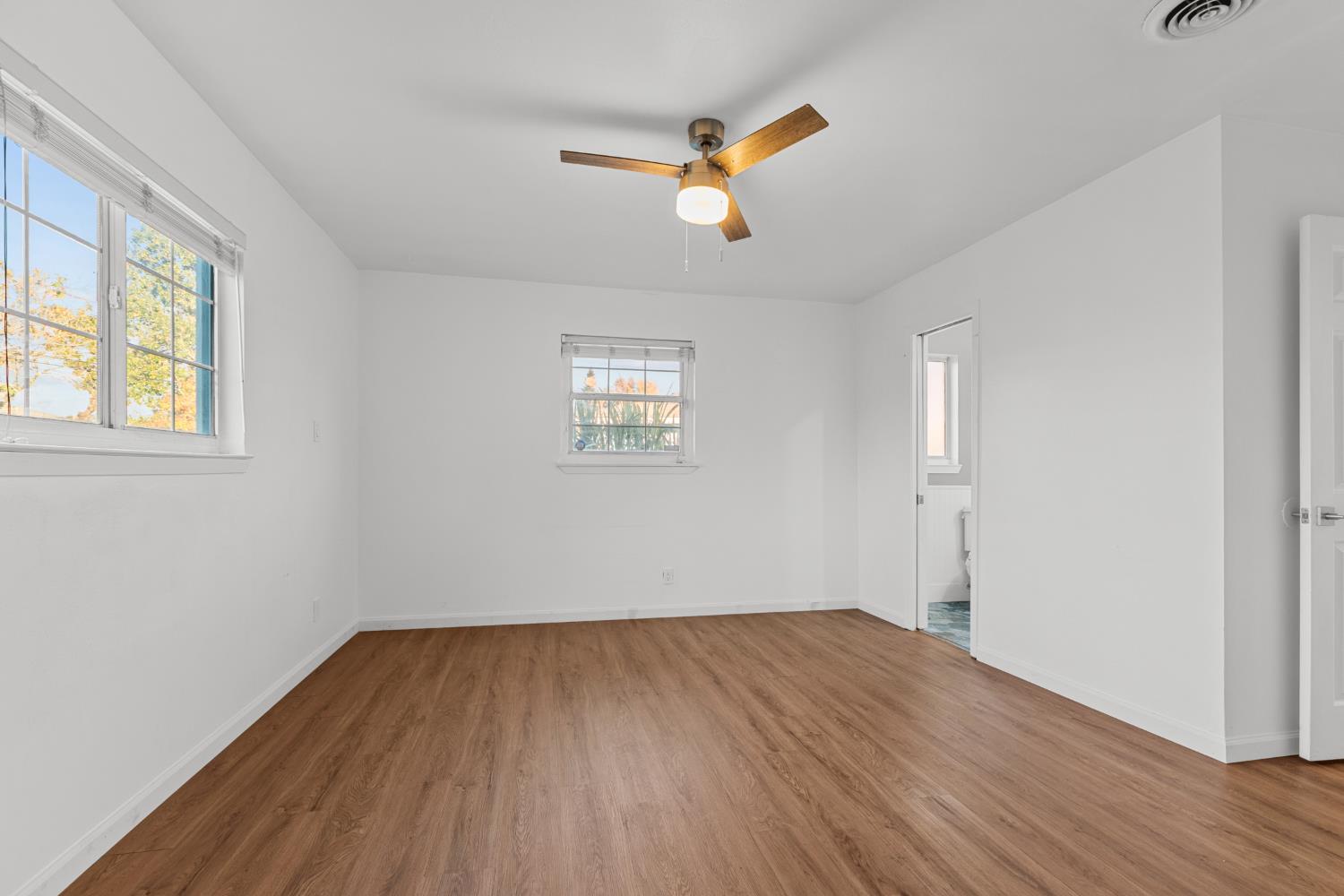 2121 Aaron Way Sacramento, CA 95822 - Photo 18 of 47 wooden floor in an empty room with a window