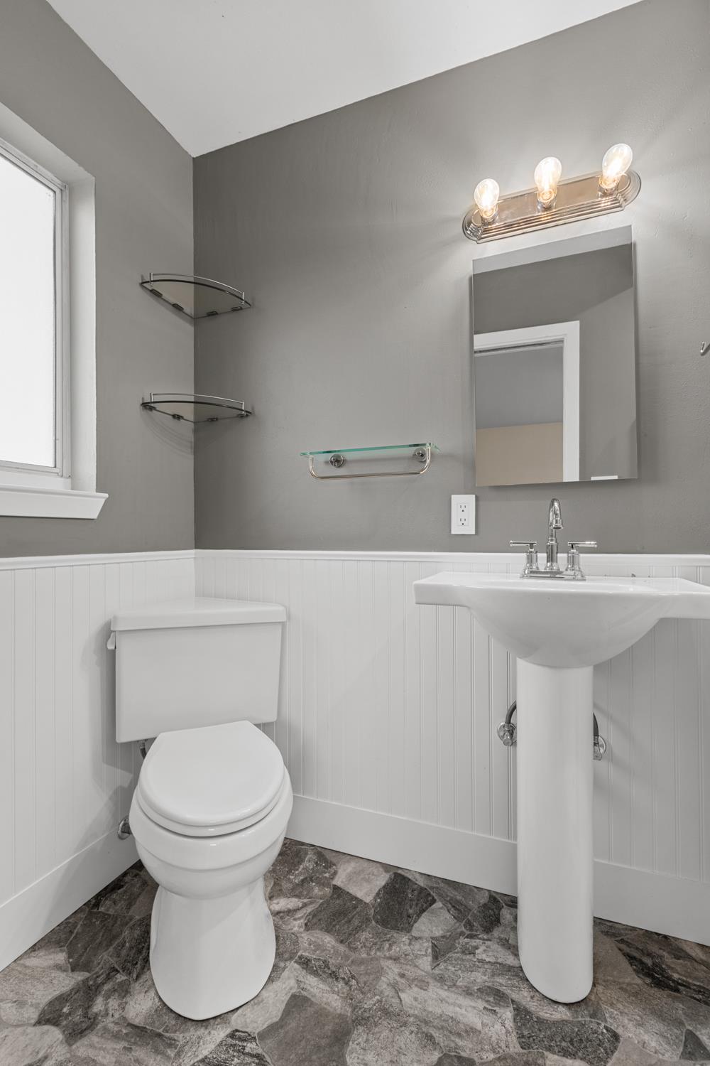 2121 Aaron Way Sacramento, CA 95822 - Photo 20 of 47 a bathroom with a sink a toilet and mirror
