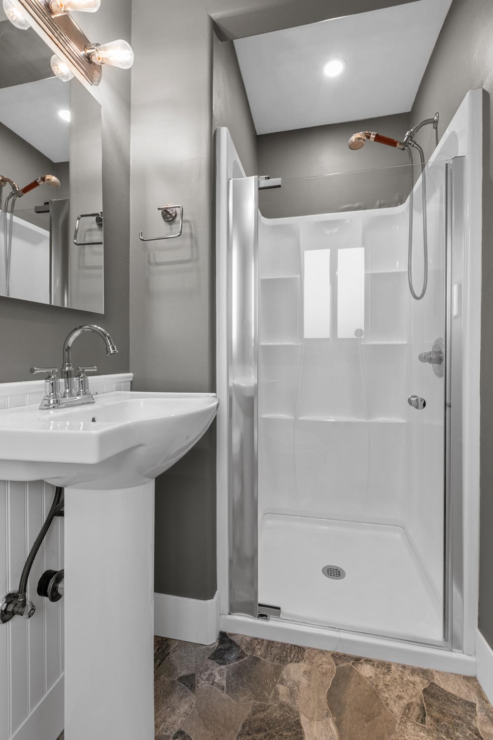 2121 Aaron Way Sacramento, CA 95822 - Photo 21 of 47 a bathroom with a shower sink vanity and mirror