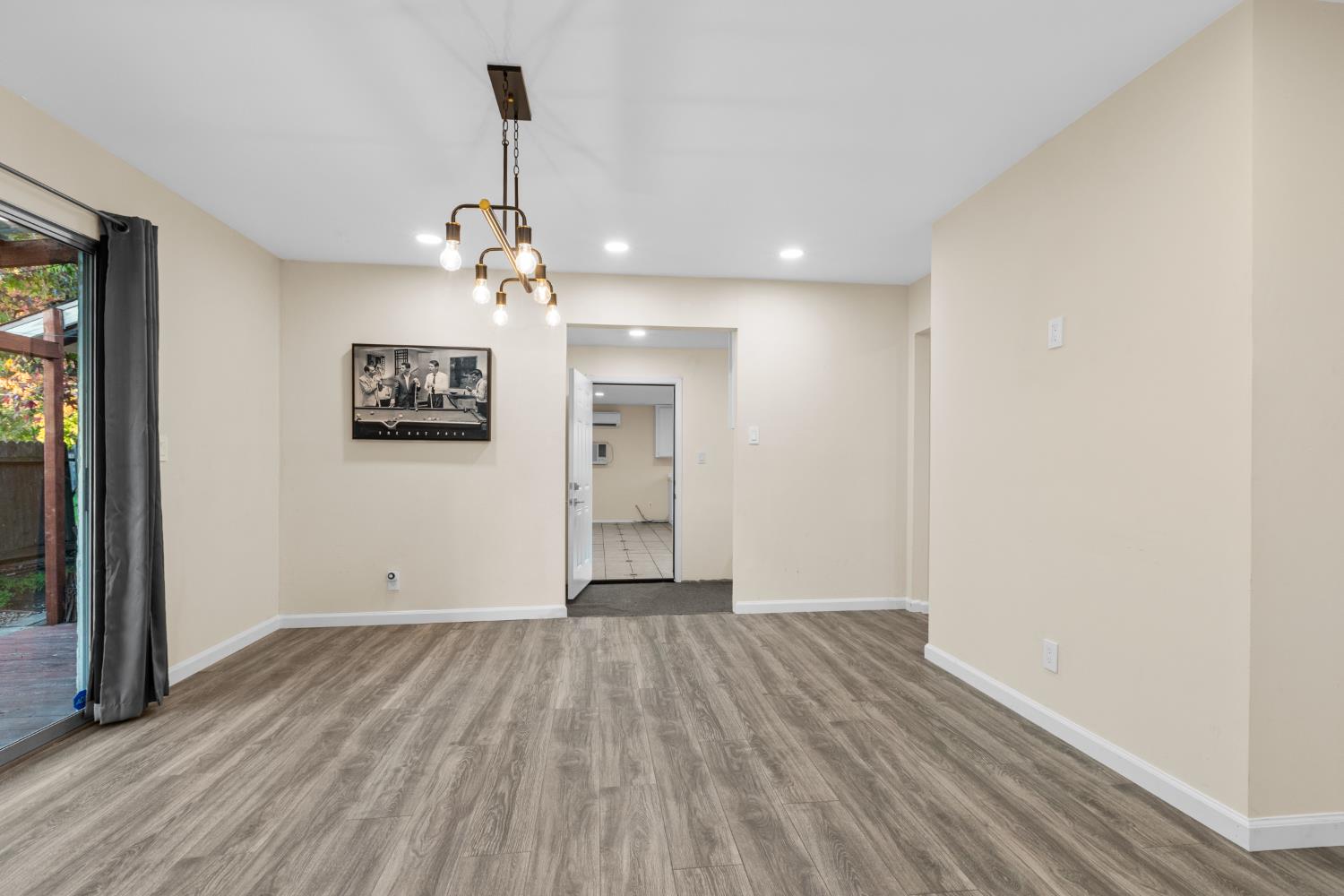 2121 Aaron Way Sacramento, CA 95822 - Photo 22 of 47 wooden floor in an empty room with a window