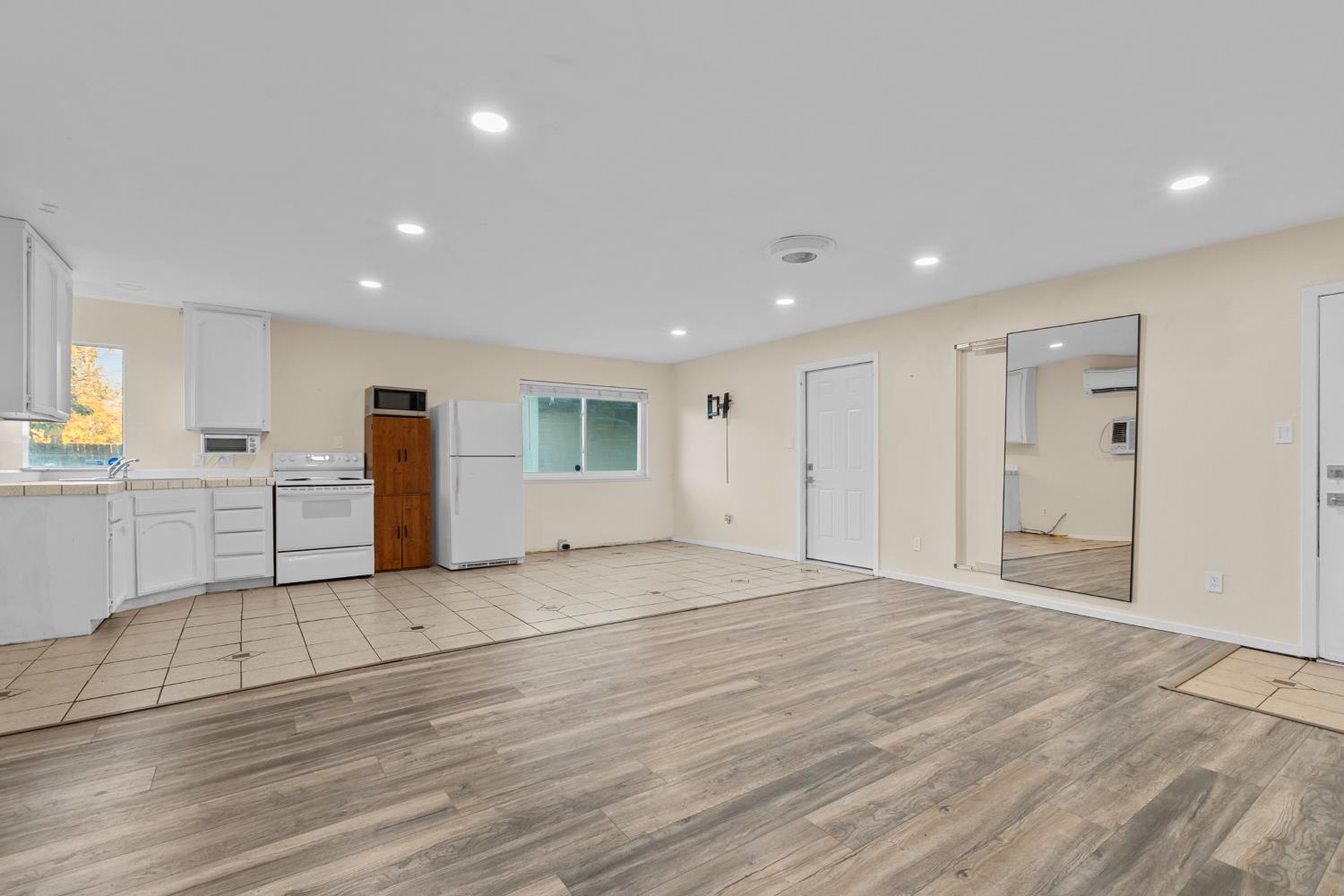 2121 Aaron Way Sacramento, CA 95822 - Photo 26 of 47 a view of an empty room with wooden floor and windows