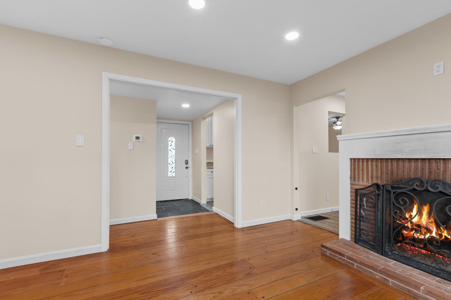 2121 Aaron Way Sacramento, CA 95822 - Photo 3 of 47 a view of empty room with wooden floor and fireplace