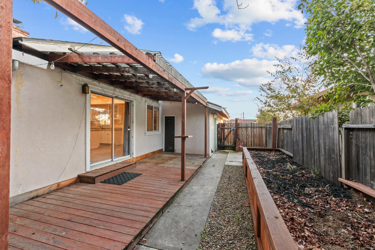 2121 Aaron Way Sacramento, CA 95822 - Photo 33 of 47 a view of backyard with wooden floor and fence