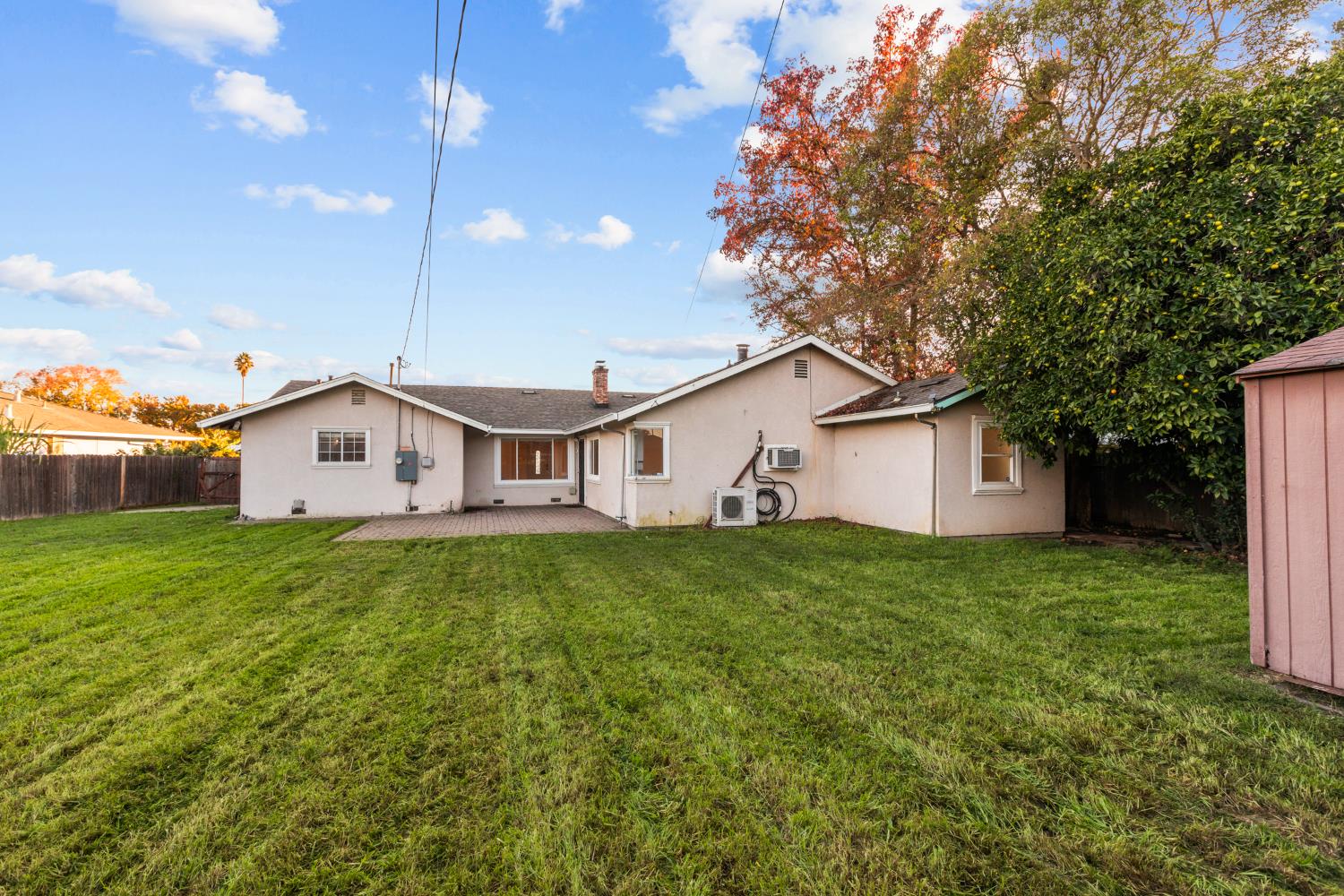 2121 Aaron Way Sacramento, CA 95822 - Photo 34 of 47 a view of a yard in front of a house with plants and large tree
