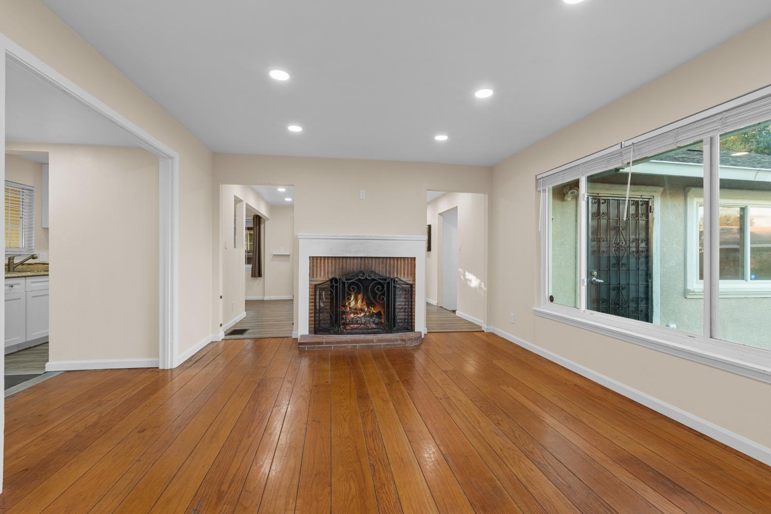 2121 Aaron Way Sacramento, CA 95822 - Photo 6 of 47 a view of a livingroom with wooden floor and a fireplace
