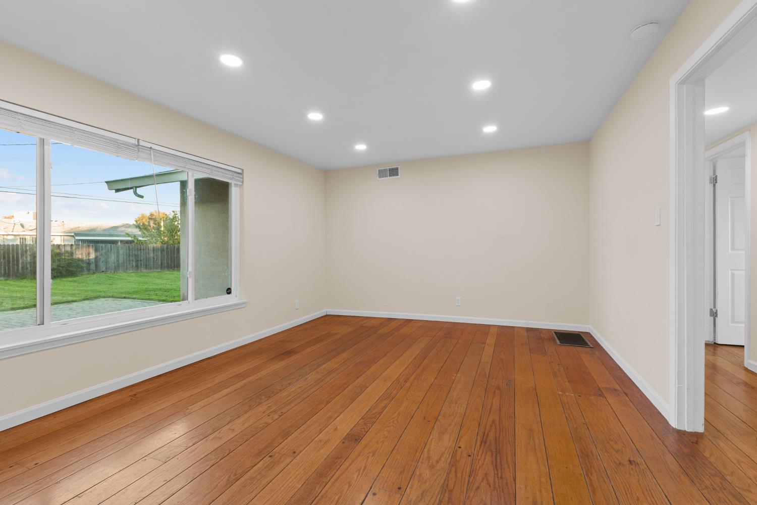 2121 Aaron Way Sacramento, CA 95822 - Photo 7 of 47 a view of room with window and wooden floor