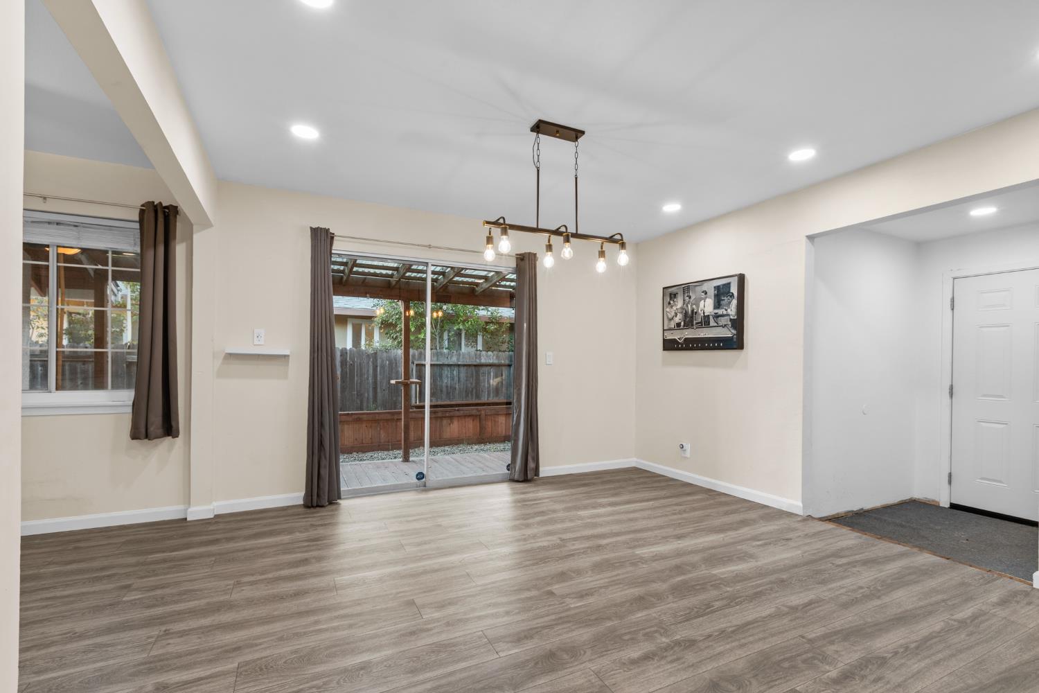 2121 Aaron Way Sacramento, CA 95822 - Photo 8 of 47 a view of an empty room with wooden floor and a window