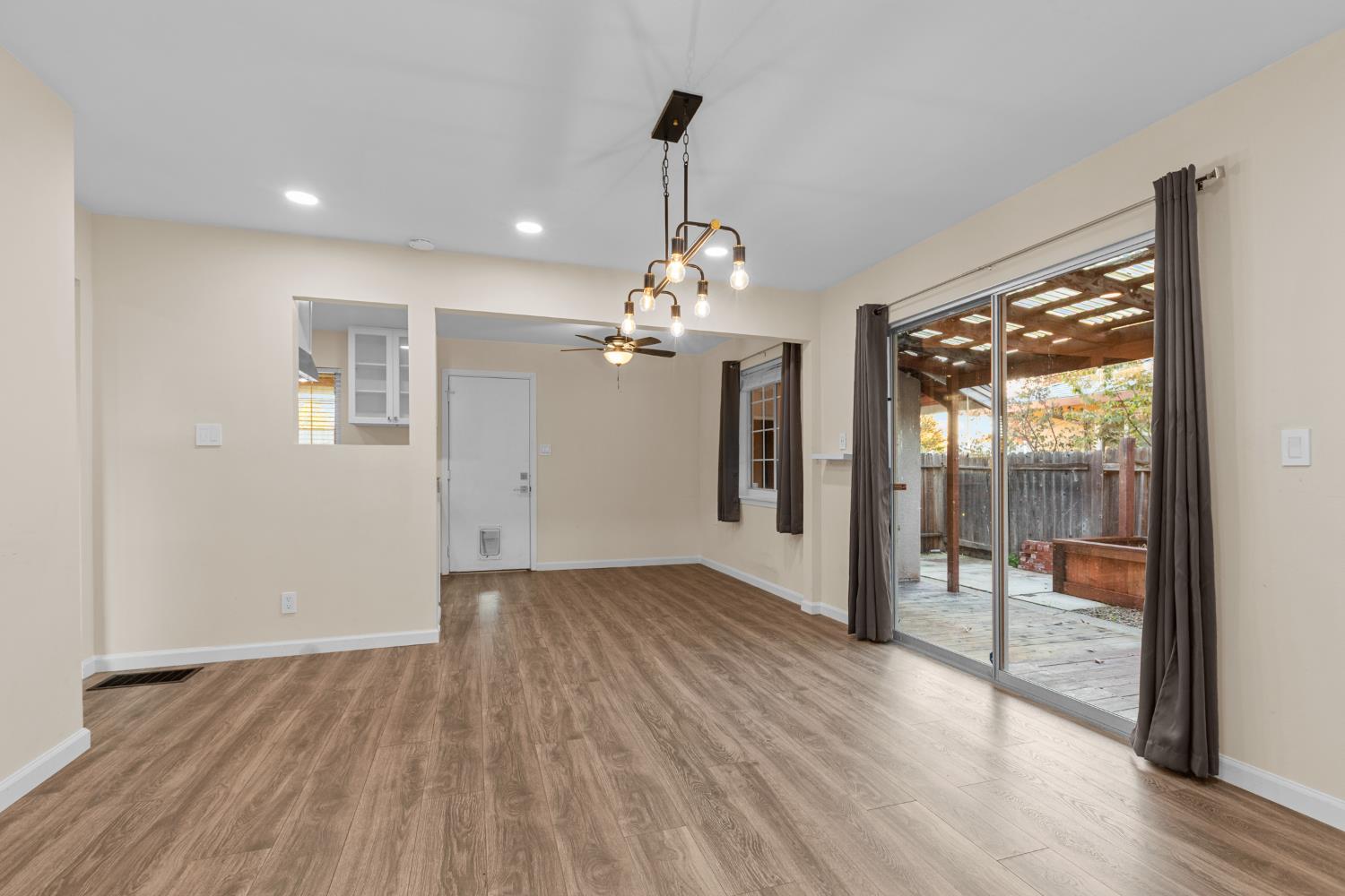 2121 Aaron Way Sacramento, CA 95822 - Photo 9 of 47 a view of a room with wooden floor chandelier and windows