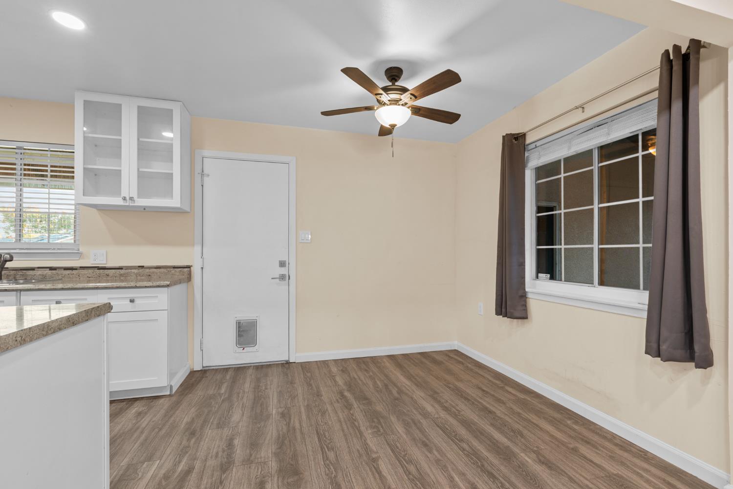 2121 Aaron Way Sacramento, CA 95822 - Photo 10 of 47 a view of a kitchen with wooden floor and a window