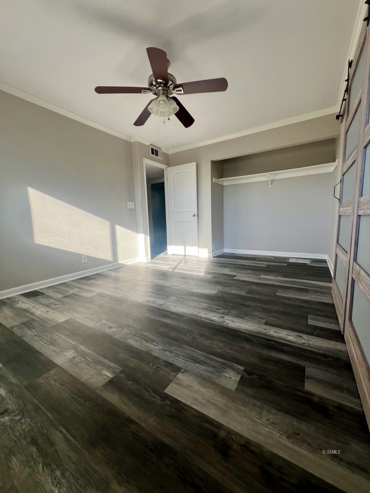 333 Traci Lane Ridgecrest, CA 93555 - Photo 21 of 30 a view of an empty room with wooden floor and ceiling fan