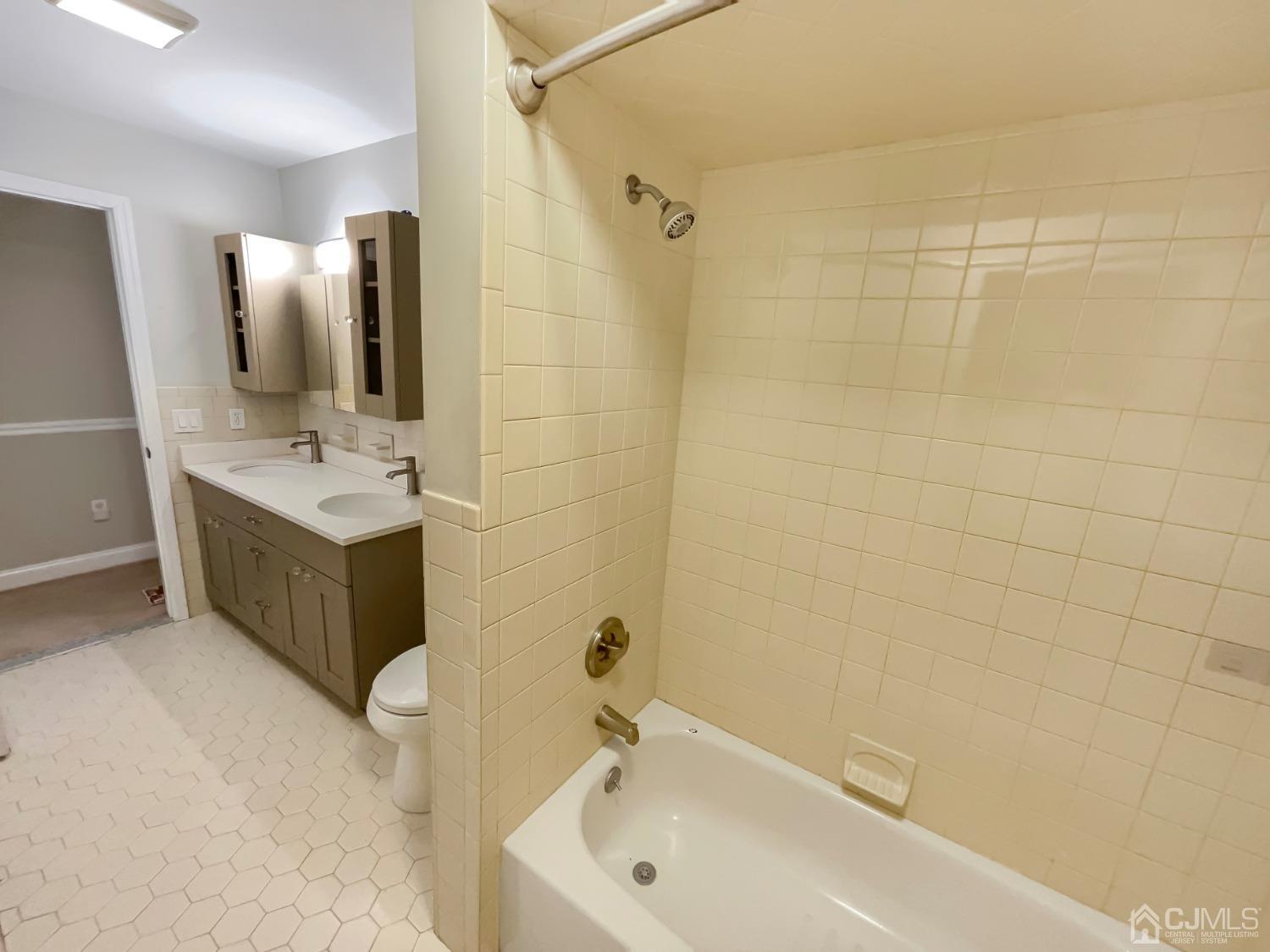 6 Ericson Avenue Helmetta, NJ 08828 - Photo 12 of 15 a bathroom with a tub sink and mirror