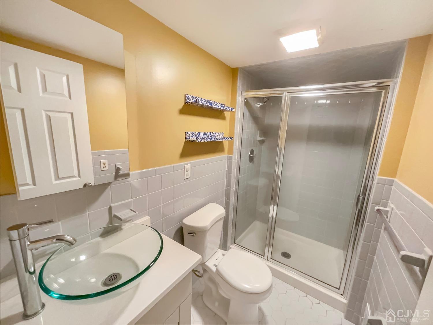 6 Ericson Avenue Helmetta, NJ 08828 - Photo 13 of 15 a bathroom with a sink toilet and shower