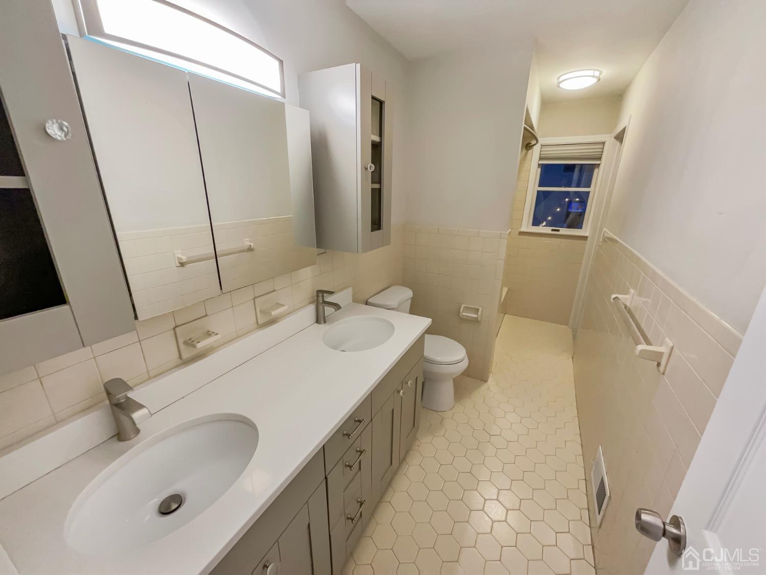 6 Ericson Avenue Helmetta, NJ 08828 - Photo 4 of 15 a bathroom with a sink and a mirror