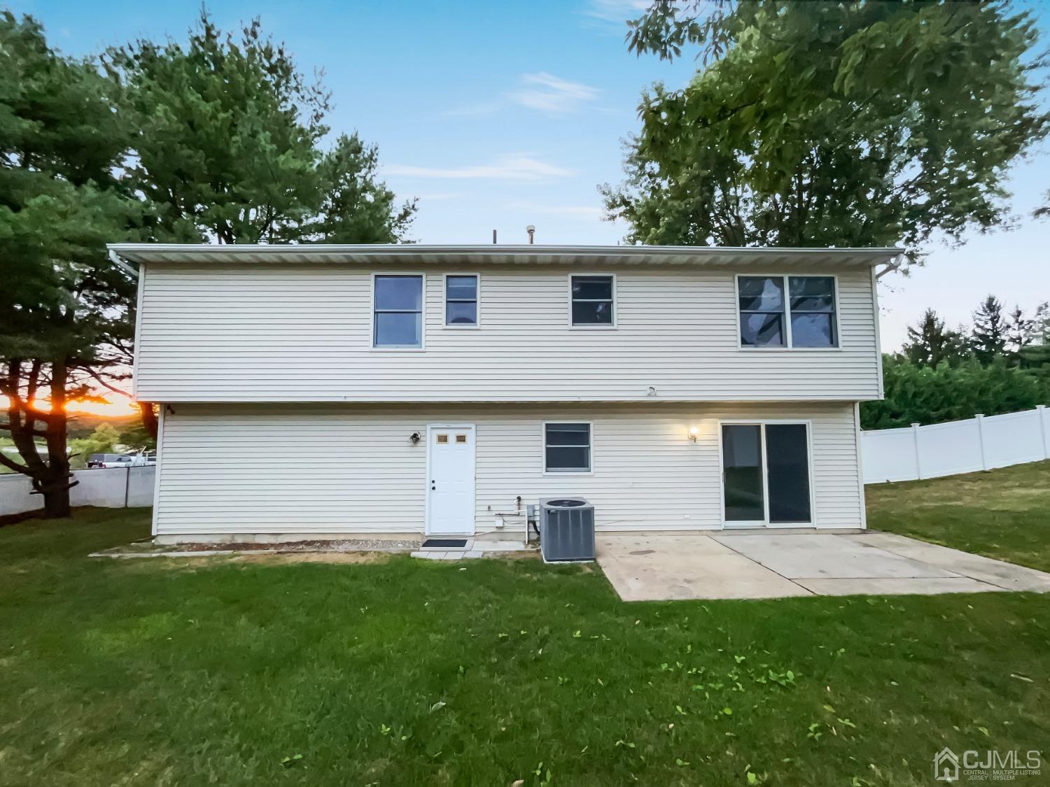 6 Ericson Avenue Helmetta, NJ 08828 - Photo 5 of 15 a view of a house with a backyard