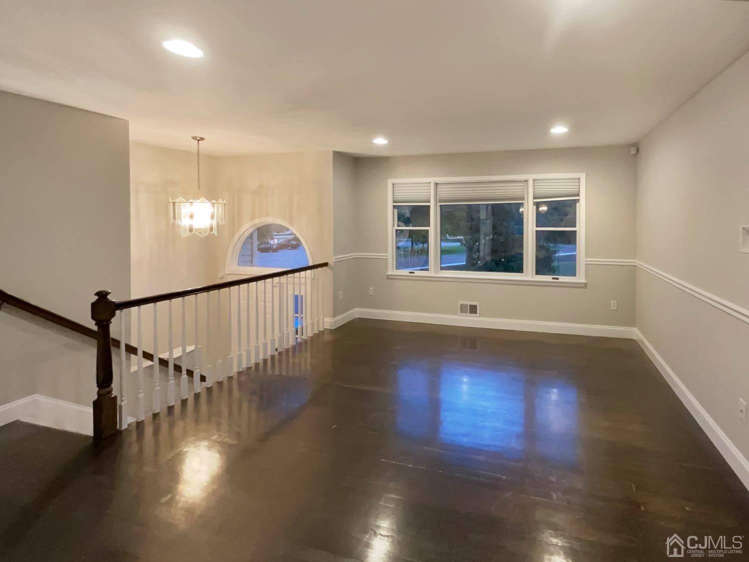 6 Ericson Avenue Helmetta, NJ 08828 - Photo 6 of 15 a view of empty room with wooden floor and fan