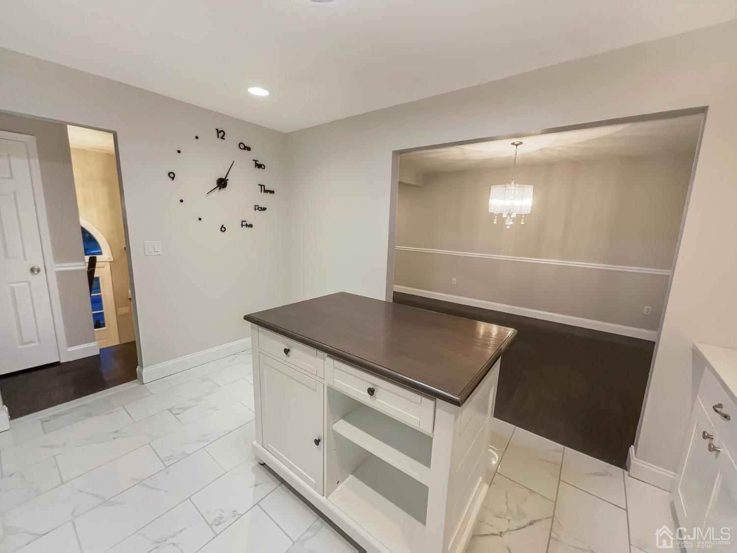 6 Ericson Avenue Helmetta, NJ 08828 - Photo 7 of 15 a kitchen with granite countertop white cabinets and white appliances