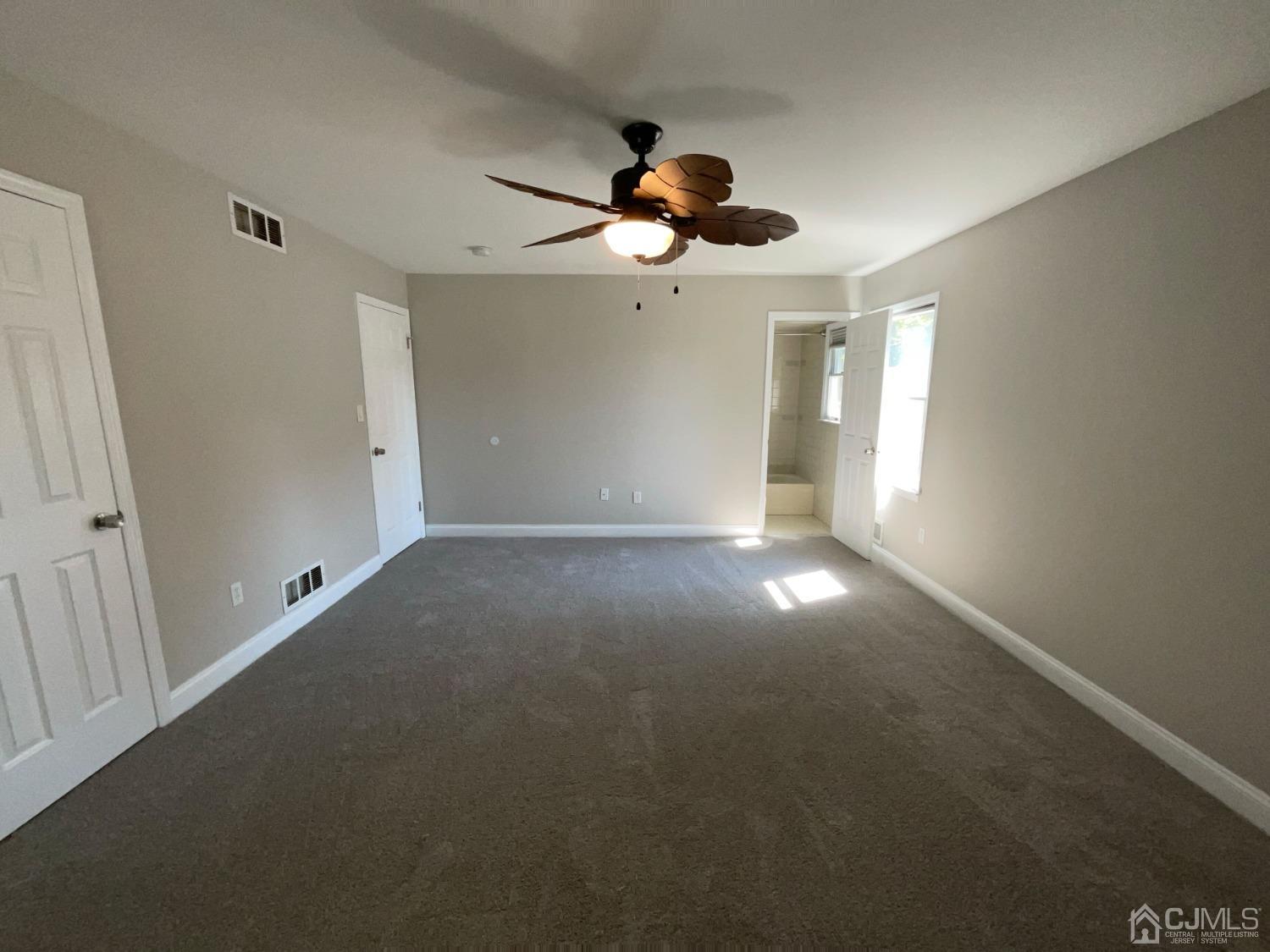 6 Ericson Avenue Helmetta, NJ 08828 - Photo 8 of 15 a view of an empty room with a window