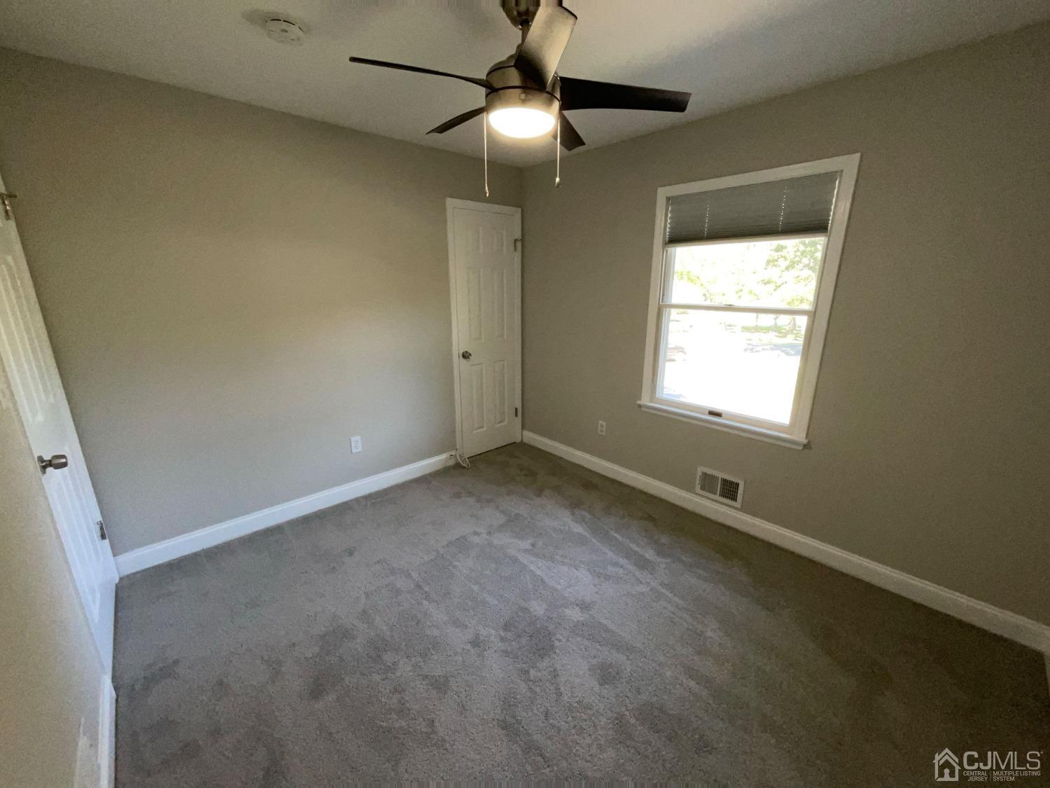6 Ericson Avenue Helmetta, NJ 08828 - Photo 9 of 15 a view of an empty room with a window