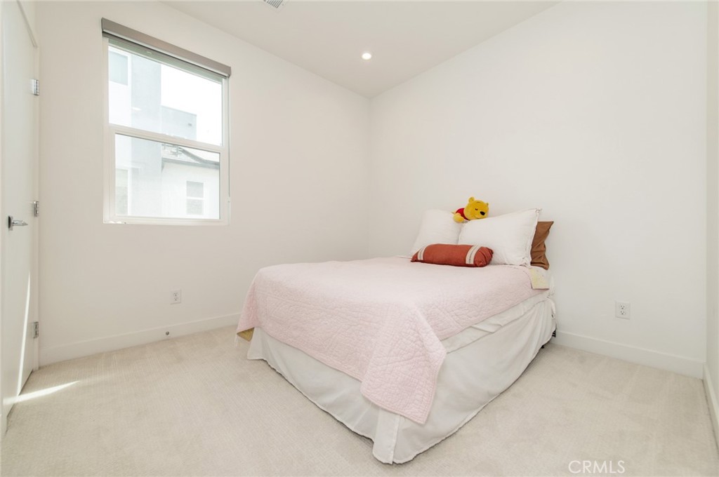 1515 West Bushell Street Anaheim, CA 92805 - Photo 12 of 22 a bedroom with a bed and window