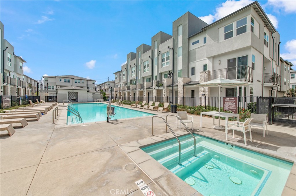 1515 West Bushell Street Anaheim, CA 92805 - Photo 20 of 22 a view of a building with a swimming pool