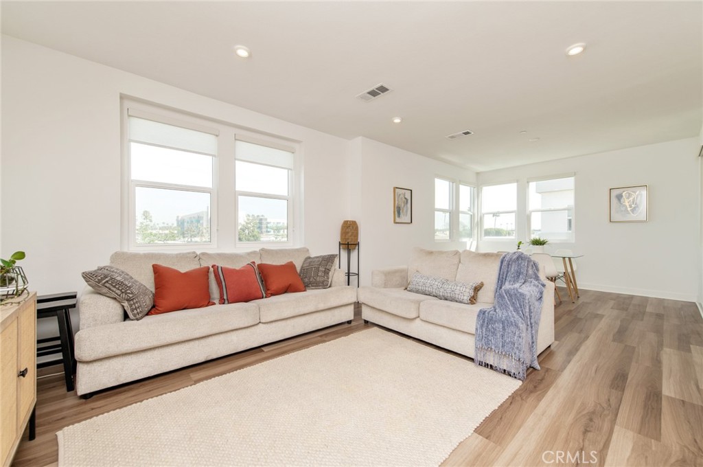 1515 West Bushell Street Anaheim, CA 92805 - Photo 7 of 22 a living room with furniture and a large window