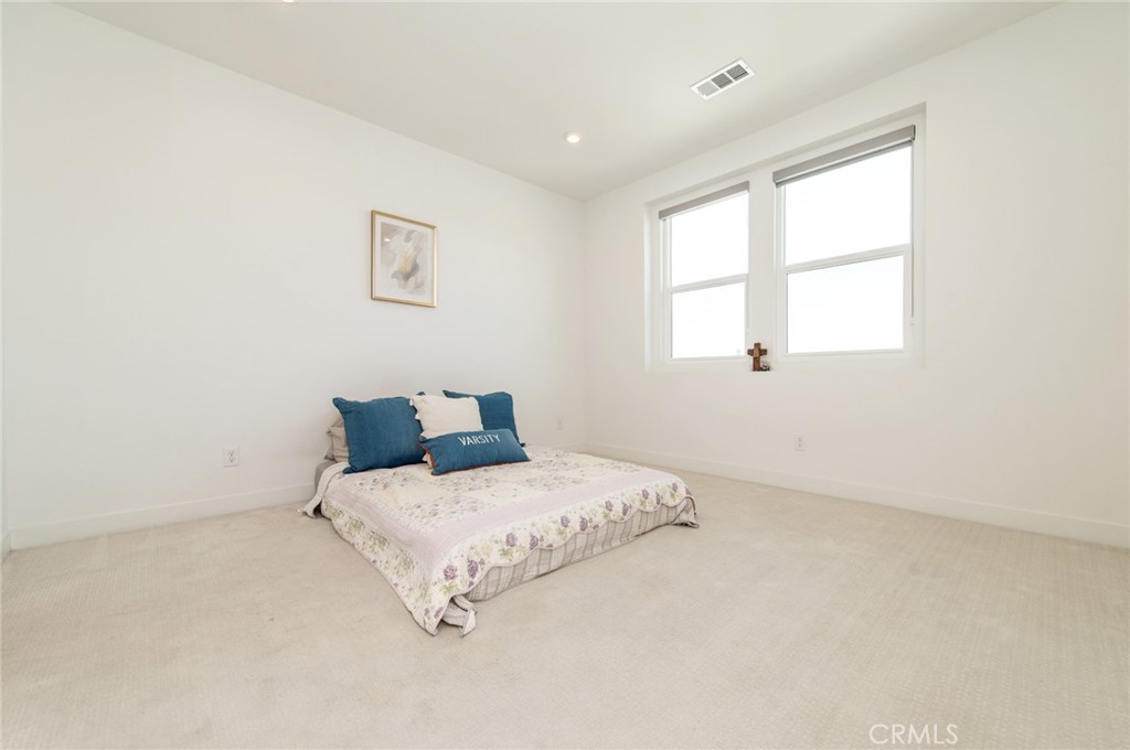 1515 West Bushell Street Anaheim, CA 92805 - Photo 9 of 22 a bedroom with a bed and a window