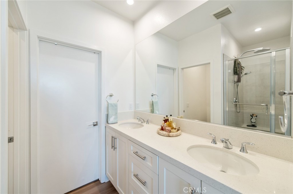 1515 West Bushell Street Anaheim, CA 92805 - Photo 10 of 22 a bathroom with a sink and a mirror