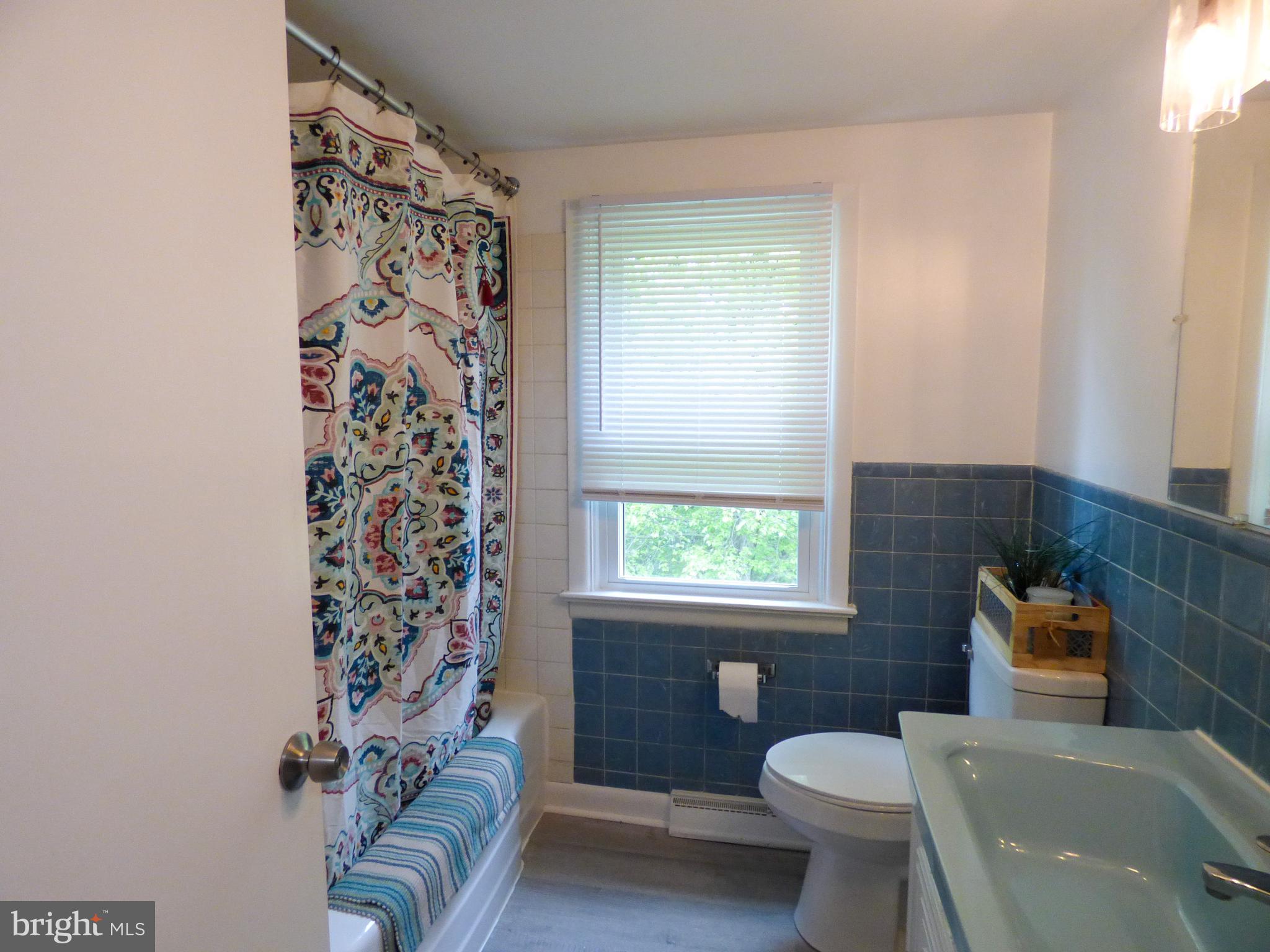 2390 Grandview Road York, PA 17403 - Photo 30 of 41 a bathroom with a toilet a sink and a bath tub