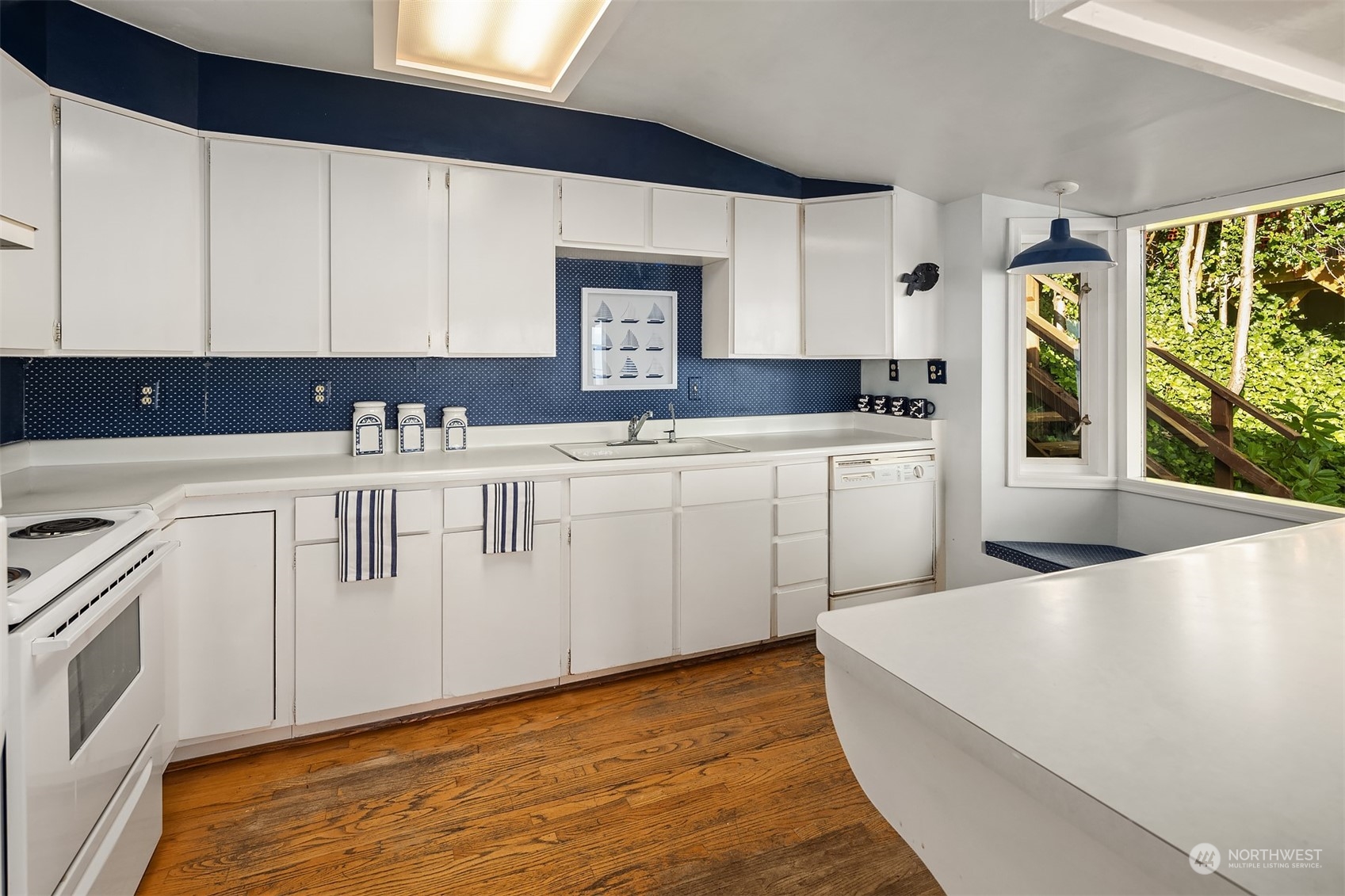 2423 Southwest 172nd Street Burien, WA 98166 - Photo 16 of 26 a kitchen with a sink a stove and cabinets