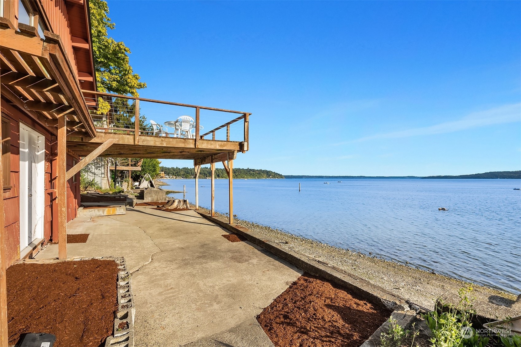 2423 Southwest 172nd Street Burien, WA 98166 - Photo 18 of 26 a view of a patio with a table and chairs