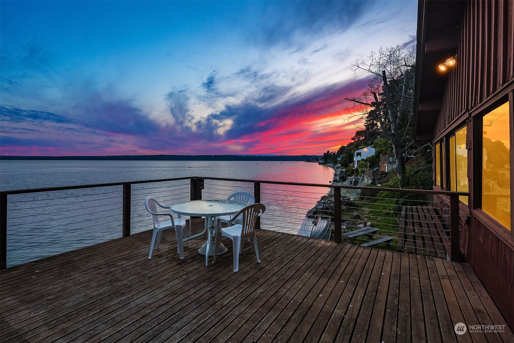 2423 Southwest 172nd Street Burien, WA 98166 - Photo 10 of 26 a roof deck with table and chairs and potted plants