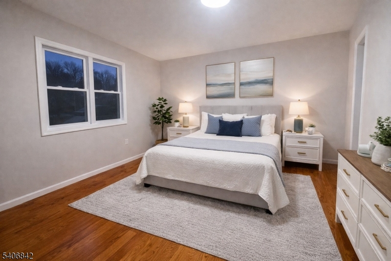 515 West End Avenue Elizabeth, NJ 07202 - Photo 2 of 9 a bedroom with a bed lamp and a window