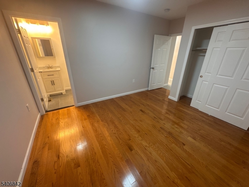 515 West End Avenue Elizabeth, NJ 07202 - Photo 5 of 9 a view of an empty room with wooden floor and a window