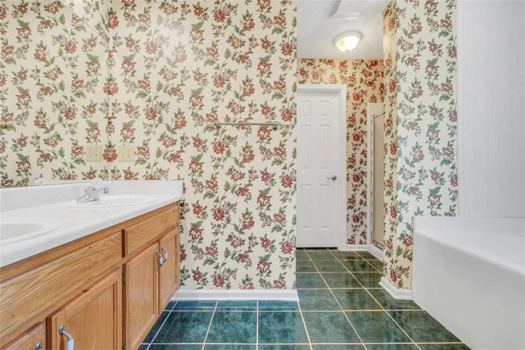 130 Deep Step Road Covington, GA 30014 - Photo 13 of 35 a bathroom with a shower and a sink