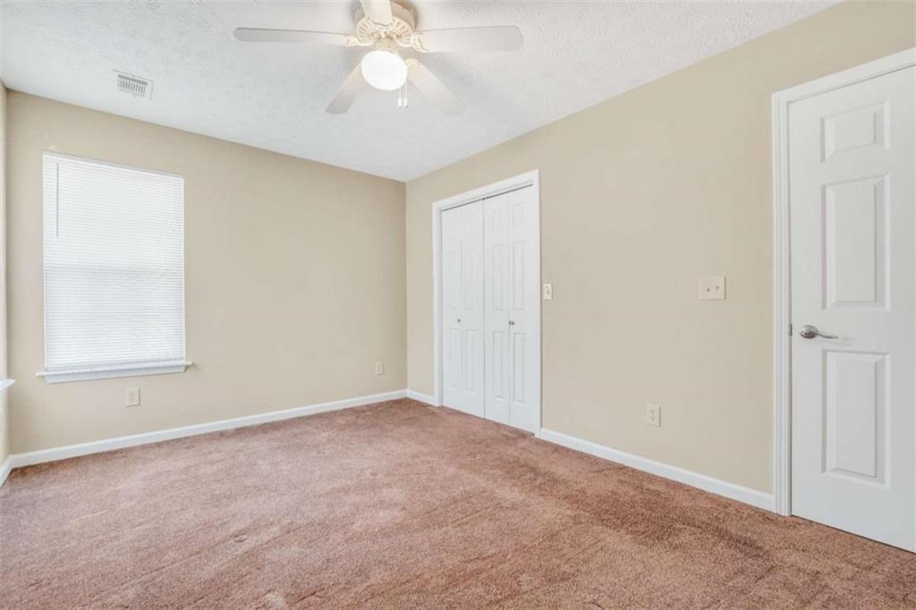 130 Deep Step Road Covington, GA 30014 - Photo 20 of 35 a view of an empty room with a window
