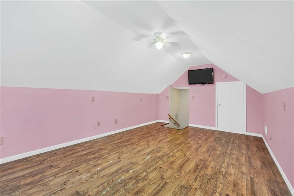 130 Deep Step Road Covington, GA 30014 - Photo 21 of 35 a view of empty room with wooden floor