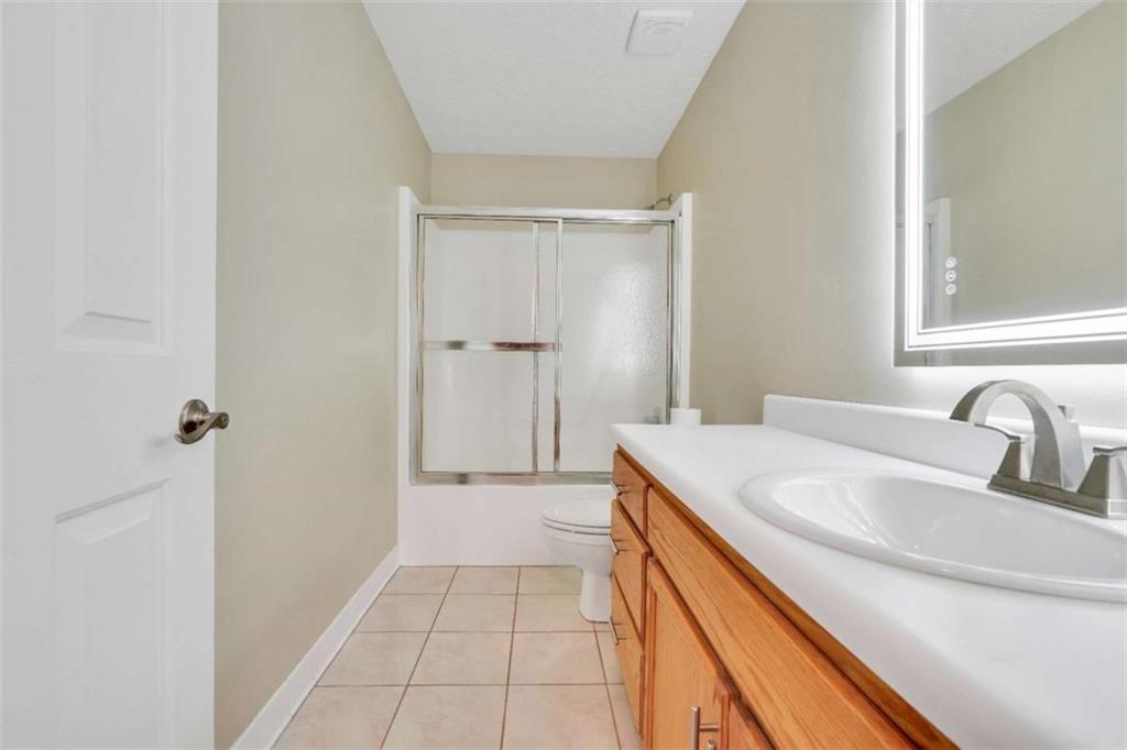 130 Deep Step Road Covington, GA 30014 - Photo 23 of 35 a bathroom with a sink and a mirror