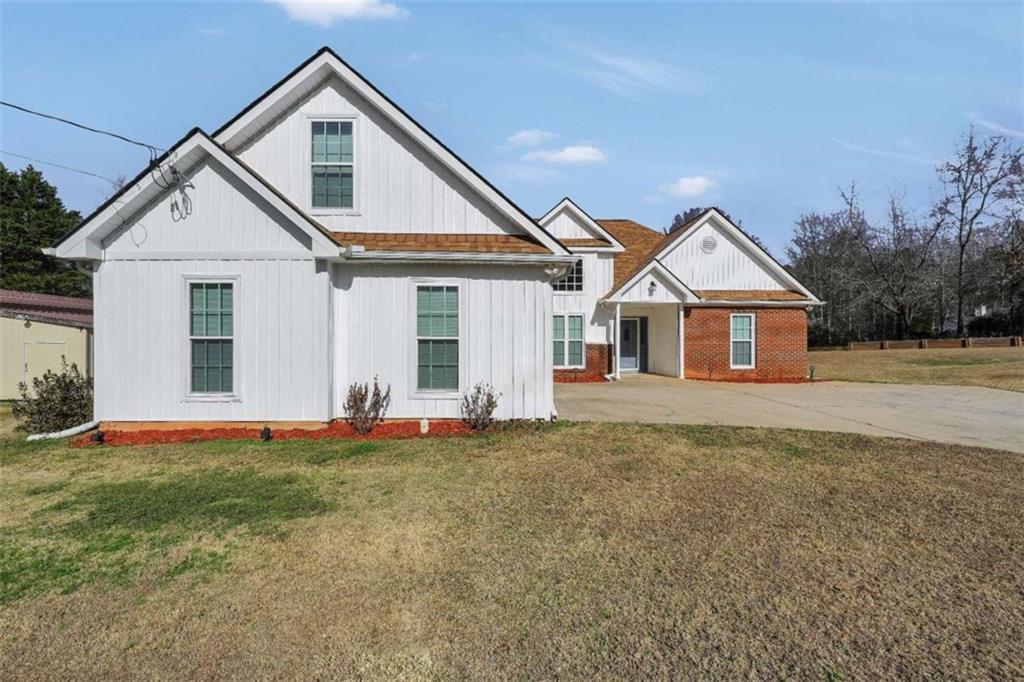 130 Deep Step Road Covington, GA 30014 - Photo 28 of 35 a front view of a house with a yard