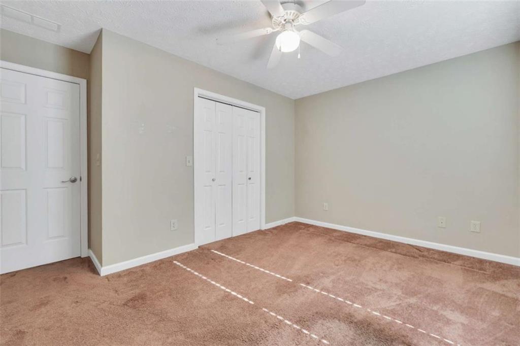 130 Deep Step Road Covington, GA 30014 - Photo 4 of 35 a view of an empty room with a fan