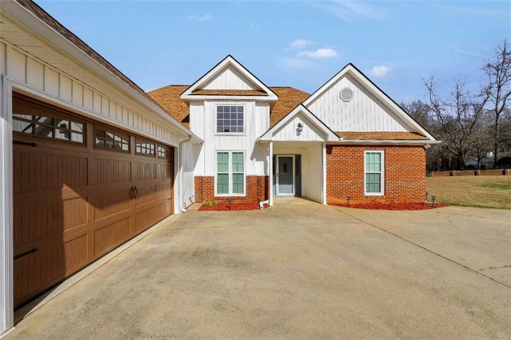 130 Deep Step Road Covington, GA 30014 - Photo 6 of 35 front view of a house with a garage