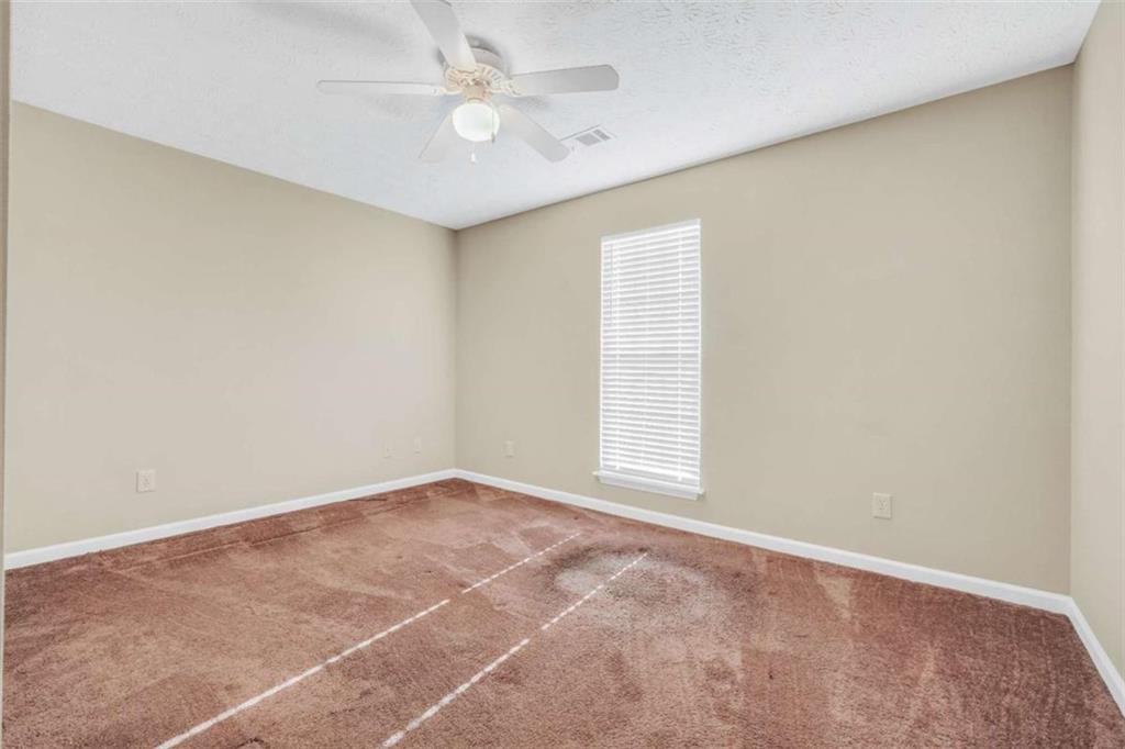 130 Deep Step Road Covington, GA 30014 - Photo 7 of 35 an empty room with windows and fan
