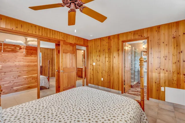 a bedroom with furniture and a window