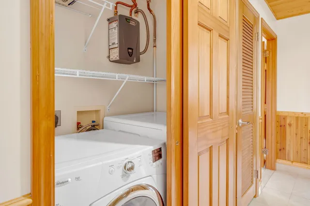 a bedroom with a bed and a ceiling fan