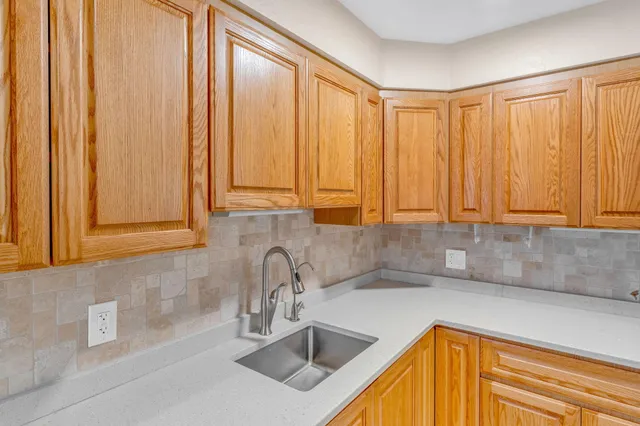 a bed room with a bed and a night stand