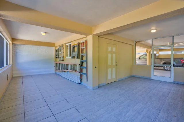 a view of walk in closet with clothes