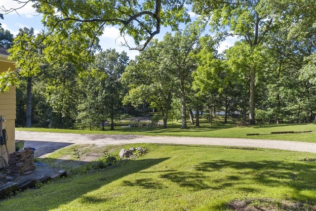 40W938 Whitney Road St. Charles, IL 60175 - Photo 2 of 20 a view of a swimming pool with a yard