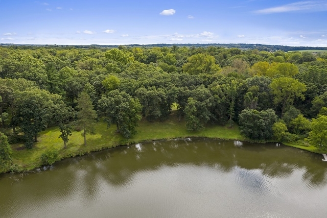 40W938 Whitney Road St. Charles, IL 60175 - Photo 20 of 20 a view of a lake with a city