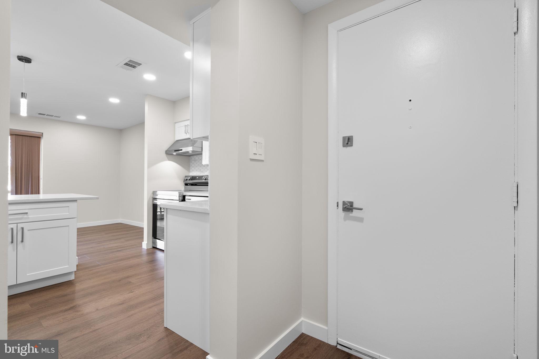 10053 Windstream Drive, Unit 3 Columbia, MD 21044 - Photo 13 of 30 a view of kitchen with wooden floor