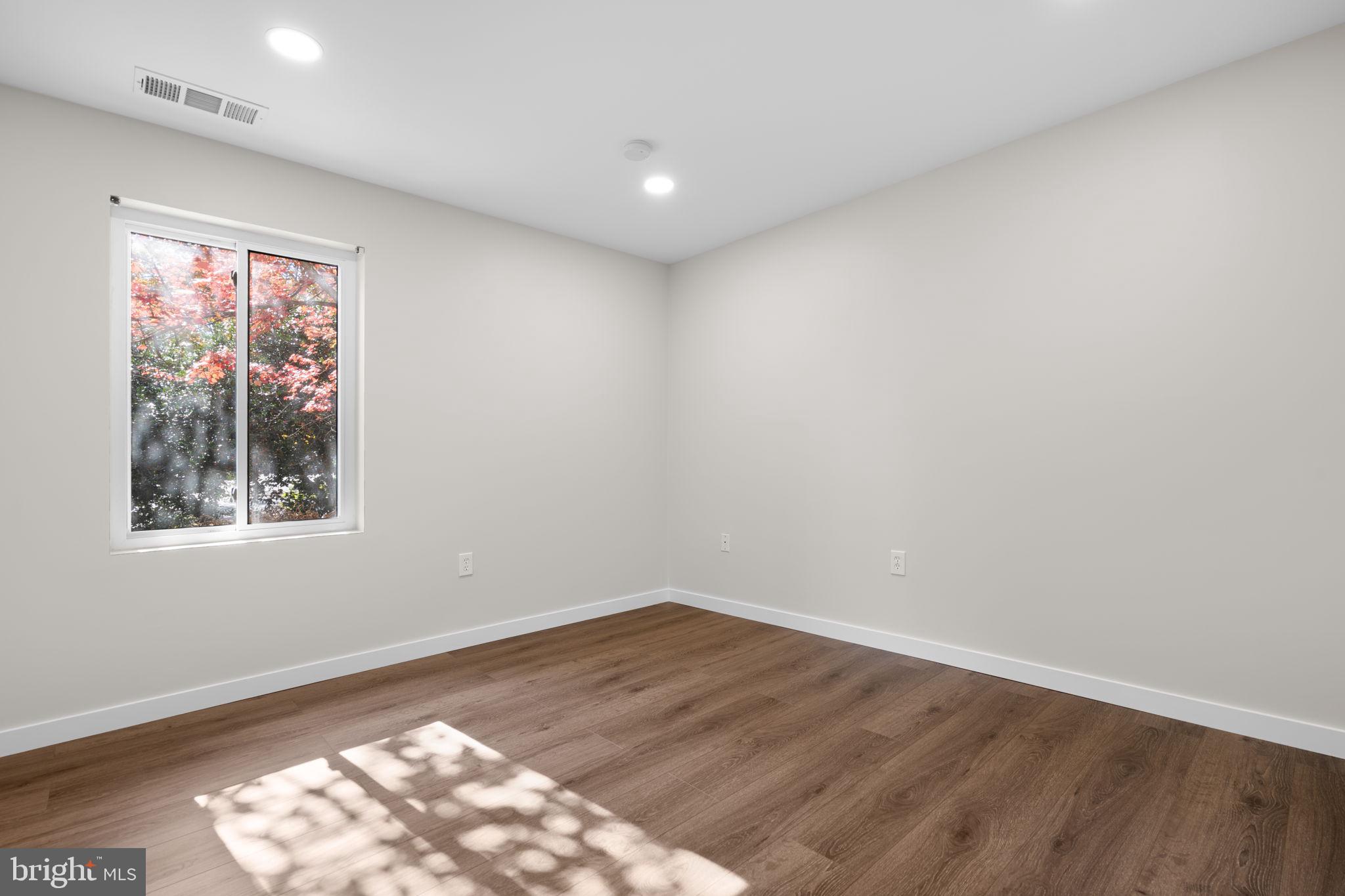 10053 Windstream Drive, Unit 3 Columbia, MD 21044 - Photo 16 of 30 a view of empty room with wooden floor and fan